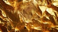 Abstract close-up of shiny gold foil with crinkled texture and light reflections creating a luxurious metallic surface