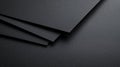 Black Paper Sheets With Overlapping Textured Surfaces Create a Simple Design Royalty Free Stock Photo