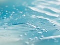 Abstract CloseUp of Light Blue Water Surface with Bubbles and Gentle Ripples. Royalty Free Stock Photo