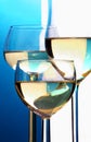 Abstract closeup, three wine glasses with white wine in front of Royalty Free Stock Photo