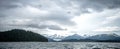 Abstract cloudy waterscape AND MOUNTAIN RANGE IN ALASKA