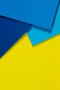 Abstract color papers geometry flat lay composition background with blue and yellow tones Royalty Free Stock Photo