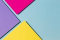 Abstract color papers geometry flat lay composition banner background with purple, yellow, magenta and blue color tones Royalty Free Stock Photo