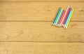 Abstract Color pencils on a wooden table. Royalty Free Stock Photo