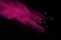 Abstract color powder splatted on black background,Freeze motion Royalty Free Stock Photo