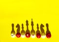 Abstract Colored Background - Red And White Chess Figures Over Yellow Background. Royalty Free Stock Photo