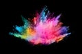 Abstract colored dust explosion on a black background.