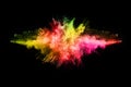 Abstract colored dust explosion on a black background.