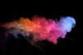 Abstract colored dust explosion on a black background.abstract powder splatted background,Freeze motion of color powder exploding/ Royalty Free Stock Photo