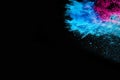 Abstract colored dust explosion on a black background.abstract powder splatted background,Freeze motion of color powder Royalty Free Stock Photo