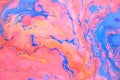 Abstract colored marble background, stains of pink and blue ink on the surface of the water. Liquid colorful backdrop. Royalty Free Stock Photo