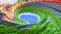 Abstract colorful background. Digital nature art. Abstract 3d topographic nature landscape with green grass and blue lake. 3D