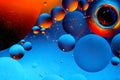 Abstract colorful background of oil circles. Oil in the water surface circles, water foam and oil bubbles. Royalty Free Stock Photo