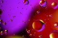 Abstract colorful background of oil circles. Oil in the water surface circles, water foam and oil bubbles. Royalty Free Stock Photo