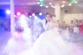 Abstract colorful blurry background, copyspace for text. Newlyweds dance their first dance. Dance is decorated with light effects