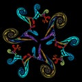 Abstract colorful flower made of spirals on a black background. Spirals of different colors, shapes and sizes alternate around and