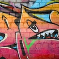 Abstract colorful fragment of graffiti paintings on old brick wall. Street art composition with parts of unwritten letters and