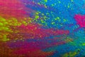 Abstract colorful Happy Holi background. Color vibrant powder on wood. Dust colored splash texture. Flat lay holi paint