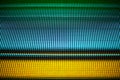 Abstract colorful parallel lines texture background, blue, green, yellow neon light strips on black backdrop, decorative ornament Royalty Free Stock Photo