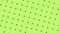 Abstract colorful pattern of small green leaves rotating and moving up on the green background. Animation. Seamless loop