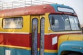 Abstract colorful shape on the metallic wall of an old bus