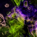 Abstract colorful smoke swirls in bright neon yellow green and violet on black background Royalty Free Stock Photo