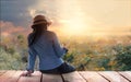 Abstract colorful, woman relaxing with smartphone in hand on outdoors in sunset rural nature