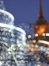 Abstract colourful background with sparkle bokeh lights and city building Royalty Free Stock Photo