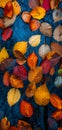 An abstract composition of colorful autumn leaves floating on a reflective water surface of a pond Royalty Free Stock Photo