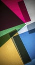 Abstract composition of colorful translucent paper sheets creating geometric patterns and overlapping hues Royalty Free Stock Photo