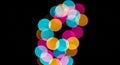 Abstract Bokeh Lights in Vibrant Colors on a Black Background colorful Royalty Free Stock Photo