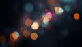 Colorful out-of-focus bokeh lights in various sizes and shades on a black background Royalty Free Stock Photo