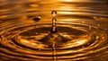 An abstract composition of golden liquid flowing like a drop of water capturing fluid motion and light Royalty Free Stock Photo