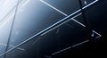Abstract composition of a modern glass building facade with blue linear lights Royalty Free Stock Photo