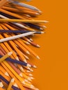Abstract composition number colored pencils on a orange surface. Design template background. 3d rendering