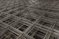 Abstract composition with pile of steel mesh for reinforced concrete