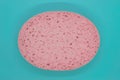 Abstract composition of pink sponge on blue background surface Royalty Free Stock Photo