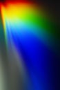 Abstract composition of radial red, yellow, green, blue rays on a shadowy gray background Royalty Free Stock Photo