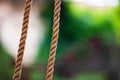 Abstract composition, texture of thick and strong hanging rope isolated on blurred background Royalty Free Stock Photo