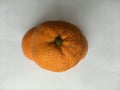 Abstract composition of three tangerines on a white background. Unusual still life.