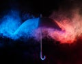 Abstract concept - blue umbrella among colorful dust clouds