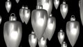 Abstract cone-shaped silver Christmas decorations in the rays of moonlight move in endless space. 3D. 4K. Isolated black Royalty Free Stock Photo