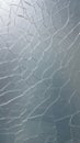 Abstract cracked glass texture with light reflecting off the surface, creating a unique pattern Royalty Free Stock Photo