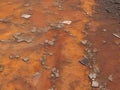 Abstract cracked rusty surface in orange-brown tones, weathered texture representing decay and melancholy for artistic backgrounds Royalty Free Stock Photo