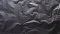 Abstract Crumpled Black Plastic or Fabric Texture with Repeating Grid Dot Pattern and Dramatic Shadow Details Royalty Free Stock Photo