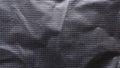 Abstract Crumpled Black Plastic or Fabric Texture with Repeating Grid Dot Pattern and Dramatic Shadow Details Royalty Free Stock Photo