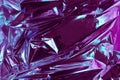 Abstract crumpled foil background. Grunge photo background. Neon colors. Blue and purple colors Royalty Free Stock Photo