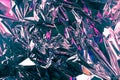 Abstract crumpled foil background. Grunge photo background. Pink and violet shadows