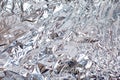 Abstract crumpled silver aluminum foil closeup background