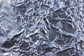 Abstract crumpled silver aluminum foil closeup background texture, detailed pattern in blue Royalty Free Stock Photo